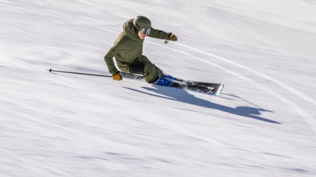 Skier skiing down a slope.