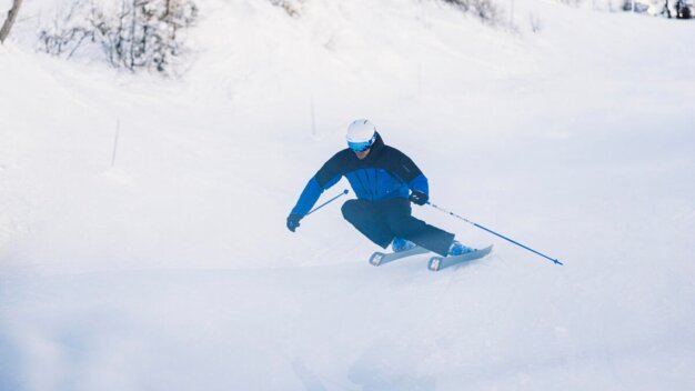 Skier skiing on a snowy slope
