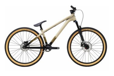 A mountain bike with tan tires.