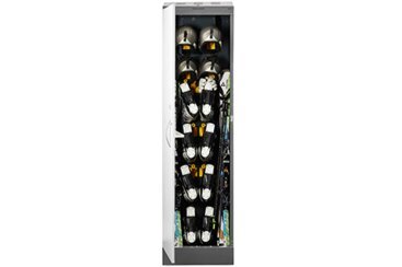 Ski locker with ski boots, helmets, and skis.