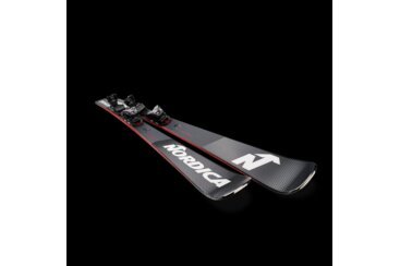 Pair of Nordica skis with bindings on black background