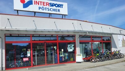 Intersport Pötscher store with bicycles displayed in front.