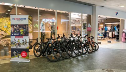Bike rentals in front of an Intersport store